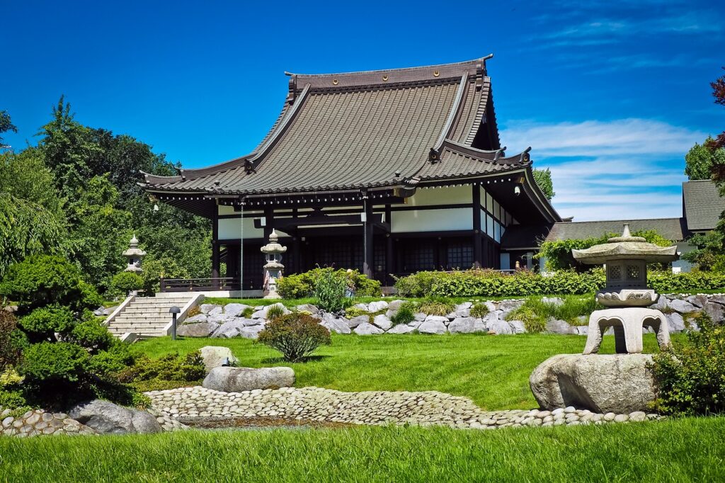 Ancient Japanese Garden with Temple in Background